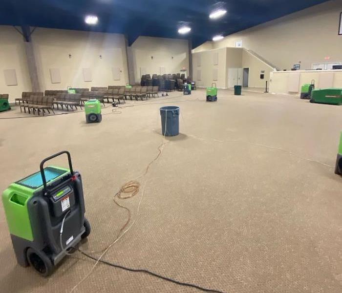 SERVPRO drying equipment on church stage floor 
