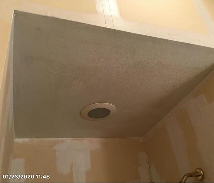 Ceiling with white antimicrobial sealant on the walls