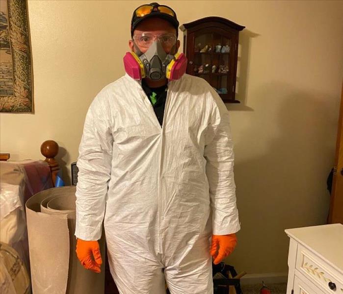SERVPRO tech in PPE suit